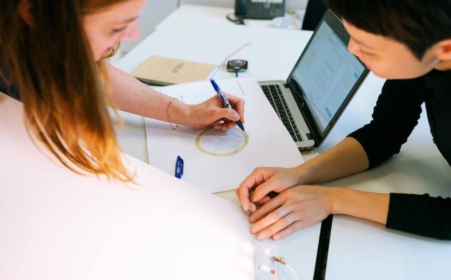 Two women working on project